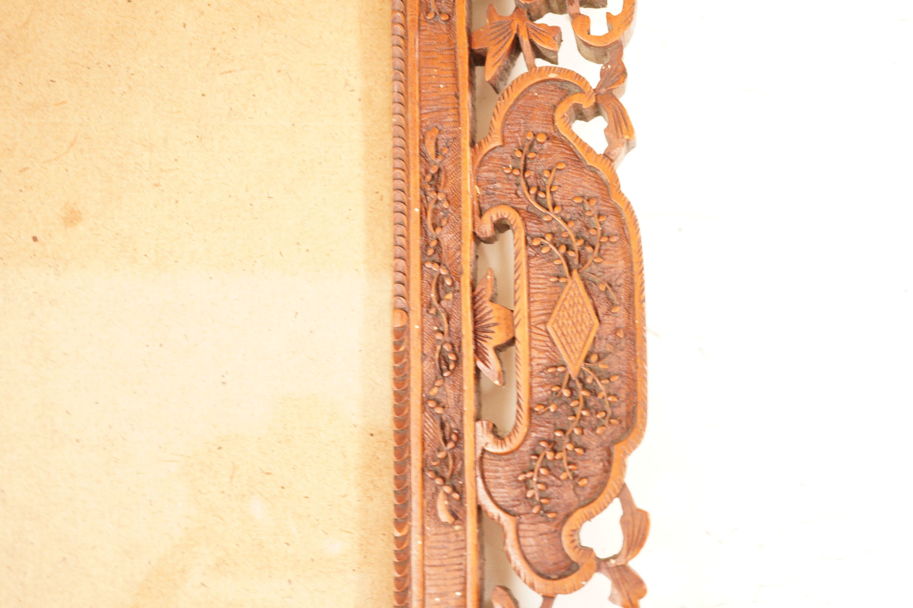 A Chinese carved sandalwood picture frame, 36x41 cm total